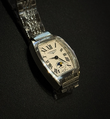 The Longines Heritage Collection L2.155.4.71.5 features a classic tonneau-shaped stainless steel case.