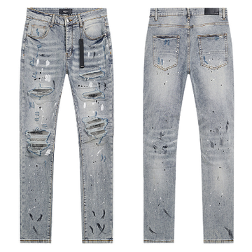 Light Blue Washed Denim Jeans with Paint Splatter and Multi-Rip Details