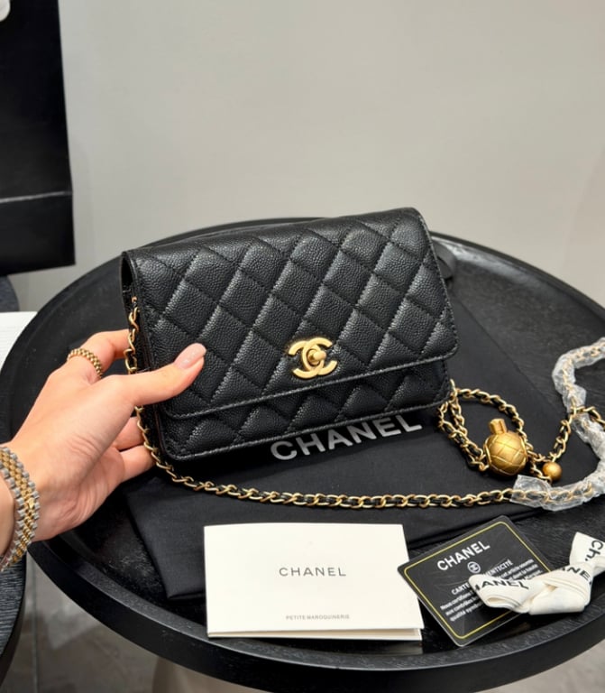 Chanel 
gold ball chain lucky bag
