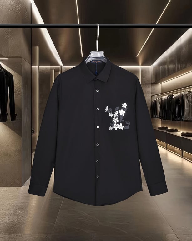 Louis Vuitton long-sleeved shirt with embossed floral logo in gold foil.