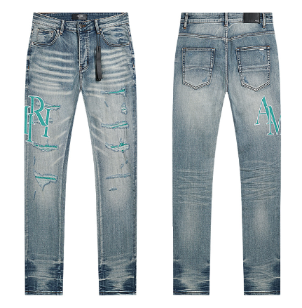 Light Blue Washed Denim Jeans with Teal AMIRI Logo and Distressing