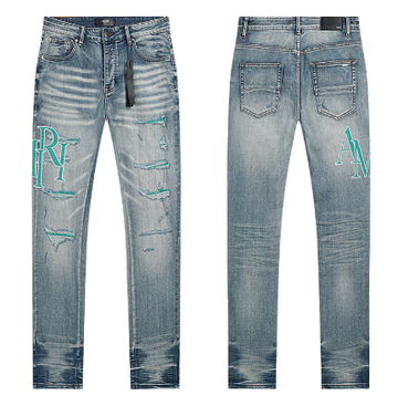 Light Blue Washed Denim Jeans with Teal AMIRI Logo and Distressing